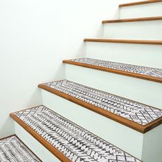 some white and brown stairs with black and white designs