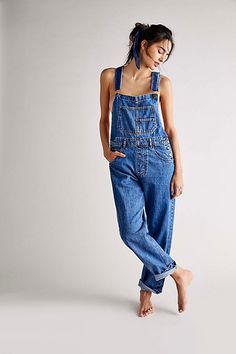 So essential and forever timeless overalls from our We The Free collection. **Fit:** Relaxed, slouchy silhouette **Features:** Bib-and-brace design, tapered legs, exaggerated bib pocket detail, rigid denim fabrication, varied distressing throughout **Why We | We The Free Ziggy Denim Overalls at Free People in Medium Wash, Size: XS Long Jumpsuit Casual, Jumpsuit Casual, Salopette Jeans, Trendy Denim, Denim Romper, Long Jumpsuits, Denim Overalls, Romper Pants, Clothing Size Chart