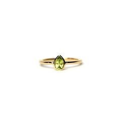 Pear Shape Peridot Ring 0.25ct / 14k Gold Peridot Engagement Ring / Solitaire Peridot Pear Shape Ring / August Peridot Ring free shipping within the USA HANDMADE AND HANDSET NATURAL PEAR SHAPE PERIDOT RING 0.25CT IN A HANDMADE BEZEL SETTING IN 14K SOLID GOLD. THE PERIDOT IS A GENUINE PEAR SHAPE PERIDOT WITH A GORGEOUS DEEP GREEN COLOR AS IT IS WITH THIS ITEM ALL MY PIECES ARE HAND MADE. THIS DELICATE AND DAINTY ENGAGEMENT RING IS MADE IN 14K YELLOW GOLD BUT I CAN ALSO MAKE IT IN 14K WHITE AND RO Peridot Birthstone Diamond Ring Fine Jewelry, Yellow Gold Peridot Stackable Rings For Wedding, Yellow Gold Peridot Diamond Ring, Fine Jewelry Peridot Birthstone Ring In Round Cut, Yellow Gold Stackable Rings With Peridot, Yellow Gold Peridot Stackable Rings For Anniversary, Fine Jewelry Peridot Birthstone Ring Round Cut, Stackable Yellow Gold Peridot Jewelry, Fine Jewelry Peridot Birthstone Ring