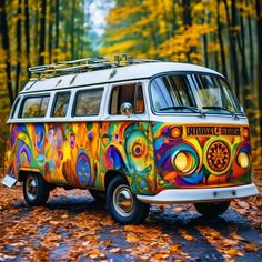 an old van painted with bright colors in the woods