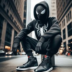 a spider man is sitting on the ground with his legs crossed and wearing black sneakers