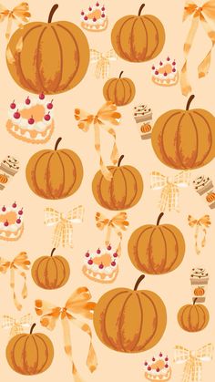 an orange and white pattern with pumpkins on it's sides, ribbons, and bows