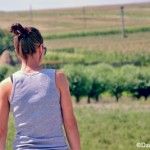 a woman standing in the middle of a field