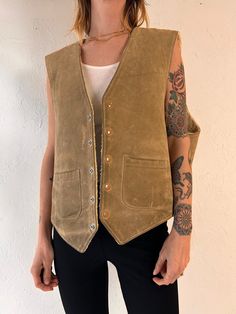 - Vintage JFS suede vest - Faux shearling lining - Very well worn in with lots of signs of age - Snaps up the front - Made in USA - Tagged XL  Chest: 24.5" Length: 24.5" We are not responsible for lost, stolen, or damaged packages once they have been shipped. Any additional customs duties or taxes incurred on international orders are the responsibility of the buyer. Please note that our items are vintage and may have minor flaws or imperfections due to their age, which adds to their unique chara Rugged Fitted Vest Outerwear, Fitted Sleeveless Rugged Outerwear, Brown Rugged Vest For Winter, Brown Rugged Winter Vest, Rugged Brown Winter Vest, Rugged Fall Vest Outerwear, Rugged Brown Vest For Fall, Leather Vest Outfit, Vest Outfits Men