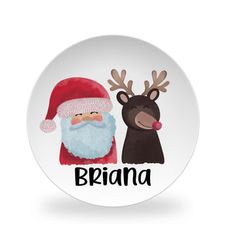 a white plate with reindeer and santa clause on it, the words braina written in black