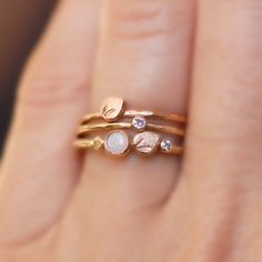 Delicate and comfortable, this little petal ring looks great worn alone as well as stacked with more rings. Makes the perfect wedding ring for the minimalist bride, or an elegant every day ring! Details: -Band - Choose 1.3mm OR 1.6mm Remember, if you are stacking it with one of my 1.6mm thick rings, choose 1.6mm, and if you are stacking it with a 1.3mm ring...choose 1.3mm. This will ensure that they sit flush together without the petal bumping into the side of the other ring causing a gap. -Peta Delicate Stackable Rings With Rose Cut Diamonds, Hand Forged Dainty Stackable Rings, Delicate Stackable Rings With Rose Cut Diamonds For Gifts, Delicate Stackable Flower Ring, Dainty Hand Forged Stackable Rings For Anniversary, Dainty Hand Forged Stackable Wedding Rings, Dainty Hand Forged Stackable Rings As A Gift, Beautiful Promise Rings, 14k Gold Opal Ring