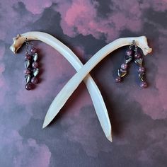 Decorate your hair with these one-of-a-kind ~ set of two ~ deer rib bone hair sticks! 🖤💜 Please see photo of measurements for sizes!!   🖤💜 HIGHLIGHTS *real deer bone hair sticks, lightly painted, sanded tips, and clear coat varnish for protection *Lepidolite and Hematite stones and metal spacers *nickel free metal chain 🖤💜 ARTIST NOTES I design and handcraft all art pieces in my smoke-free home with my two dogs. No animals are harmed to make your art.  My pieces are one of a kind, and I put my heart and soul into bringing new life to these animals through art. My pieces are delicate and fragile, please handle with care. I craft all pieces to last using industrial-strength adhesives. I welcome your questions and I love doing custom pieces. Please message me your inquiries. Please read Ren Fair Accessories, Witchy Accessories, Witchy Hair, Rabbit Ideas, Antler Crafts, Rib Bones, Ren Fair, Bone Crafts, Bone Art