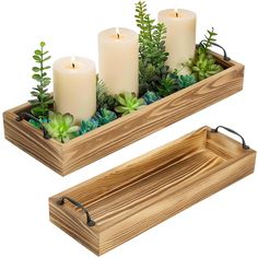 two wooden trays with candles and succulents