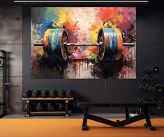 a gym with two dumbbells in front of a colorful painting on the wall