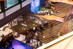 an overhead view of people standing in front of stairs