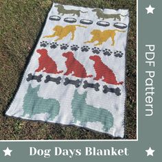 the dog days blanket is laying on the grass with stars around it and an image of dogs