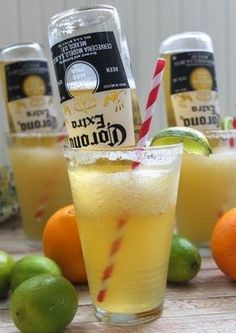 oranges, limes and lemonade are arranged on a table