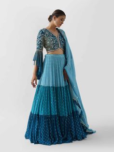 Blue Three Layered Lehenga Paired With Blouse And Dupatta - Suruchi Parakh - East Boutique Two Layer Lehenga, Crepe Lehenga Designs, Layered Lehenga Indian Outfits, Flare Blouse Design, Monochrome Outfit Indian, Layered Lehenga Designs, Designer Blouse Patterns For Lehenga, Layer Lehenga Designs, Sleeves Design For Lehenga Blouse