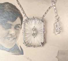 Offering an exquisite EXTREMELY RARE designer signed circa 1920s - 1930s era Art Deco/Edwardian rhodium plated camphor glass and crystal rhinestone dress/fur clip that can also be worn as a pendant necklace.  The perfect "Something Old" Bridal shower gift!  This unusual treasure will as look fantastic with a pair of jeans and a tee as it will with a Bridal gown. It's getting more and more difficult to find these Art Deco camphor pieces but to find one in dress clip form is so unusual.  The dress Camphor Glass Jewelry, Black Hills Gold Jewelry, Vintage Wedding Jewelry, White Gold Necklaces, Glass Pendant Necklace, Deco Jewelry, Art Deco Diamond, Vintage Jewels, Art Deco Jewelry