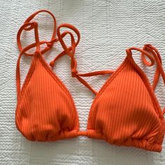 Nwot Eco Orange Bea Ribbed Triangle Bikini Top Size Xs Turn Heads At The Beach In The Eco Orange Bea Ribbed Triangle Bikini Top From Pacsun. This Eye-Catching Swimwear Piece Features A Vibrant Orange Hue And A Ribbed Fabrication, Adding A Touch Of Sophistication To Your Poolside Look. With Its Classic Triangle Silhouette And Adjustable Straps, This Bikini Top Is A Must-Have For Those Who Appreciate Timeless Style With A Modern Twist. Solid Color Bikini Top Minimal Coverage Lined; Unpadded Good S Pacsun Swim, Solid Color Bikinis, Good Stretches, Vibrant Orange, Ribbed Fabric, Pacsun, Timeless Style, At The Beach, Womens Swim