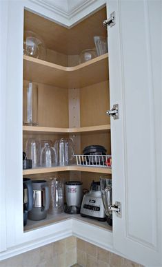 an open cabinet with many items in it