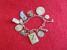 A Vintage 1970's Sterling Silver Charm Bracelet With 10 Charms - WISBA Woman Bowler. Visit our shop for awesome retro photos, vintage jewelry, sports memorabilia and home decor. Size: 7" Long (When Opened & Laid Flat) & Inside Circumference Measures Approx. 6 3/4". Material: Sterling Silver Condition: Very Good+. Year: 1970's Signed: Unsigned. Marked Sterling. Inventory #: 4043 Retro Charm Bracelet Gift, Retro Silver Collectible Jewelry, Retro Nickel-free Bracelet, Retro Metal Charms Jewelry, Nickel-free Retro Bracelet, Silver Costume Jewelry Charm Bracelet With Vintage Charm, Retro Metal Charm Bracelet, Adjustable Vintage Jubilee Charm Bracelet, Retro Silver Charm Bracelet