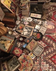 a pile of assorted items sitting on top of a rug