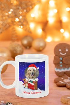 a coffee mug with a dog wearing a santa hat