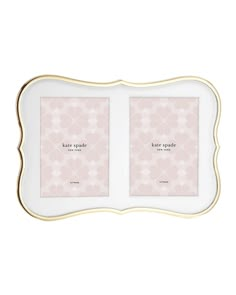 two white and gold frames with the words kate spadee in pink flowers on them