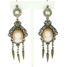 "Here we have a magnificent pair of antique earrings that were crafted from solid 14k yellow gold during the early Victorian period. They feature an incredibly detailed chandelier drop dangle design with an oval hardstone cameo neatly set at the center of the dangle, showing a lovely portrait of a woman with amazing detail that still remains very well intact. They are further surrounded by intricate open work adorned with delicate milgrain etching with three lovely tassels gently dangling from t Pearl Chandelier, Antique Earrings, Diamond Cluster, Natural Pearls, Rose Cut, Ear Piercings, Beautiful Earrings, Antique Jewelry, Diamond Cuts