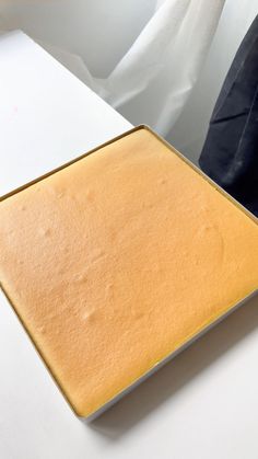 a close up of a square cake pan on a table