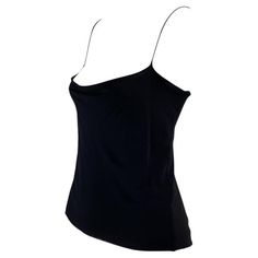 Presenting a sensual Gucci tank top designed by Tom Ford. This uniquely shaped tank top features a cowl neck and spaghetti straps with a similar cowl draping to expose the back. This shirt is not your average tank top; it was designed for the Spring/Summer 1997 collection and is the perfect chic elevation for the standard tank. Approximate measurements: Size - IT42 Bust: 30” - 38” Waist: 30” Shoulder to hem: 22” Cami Top With Built-in Bra For Evening, Silk Cami Top With Built-in Bra, Elegant Fitted Top With Tank Straps, Sleeveless Evening Tops With Built-in Bra, Elegant Fitted Camisole With Built-in Bra, Evening Stretch Camisole Tank Top, Elegant Sleeveless Gucci Top, Stretch Camisole Tank Top For Evening, Fitted Camisole Tank Top For Party