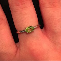 "A dainty oval-shaped genuine 6mm x 4mm genuine faceted Peridot prong set on a sterling silver ring, which makes a great birthstone ring for those August Birthdays! Wrapped in a box ready for gift giving.(r-nc-120) Here's a stellar 5 star review: \"The ring is beautiful and dainty! The stone is clear and set nicely. Shipping was fast. Very happy!!\" \"Perfect, perfect, perfect! LOVE my ring. This is a great store.\" Ring Info --------------------------------------- Genuine Peridot measure 6mm x August Birthdays, Ring Minimal, 5 Star Review, Small Ring, August Birthstone, Perfect Love, Peridot Ring, Green Peridot, Ring Sizer