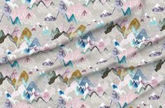 an image of a fabric with mountains and clouds in pastel colors on white background