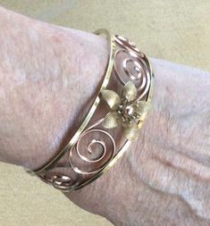 "Featuring this beautiful two-tone rose and yellow gold floral cuff. The bracelet measures 2-1/8\" diameter and will fit a smaller wrist. It is in very good vintage condition and is hallmarked \"Krementz\"." Formal Rose Gold Flower Bracelet, Gold Flower Bangle, Vintage Rose Gold Bracelet For Anniversary, Gold Flower Cuff Bracelet As Gift, Gold Flower Cuff Bracelet For Gift, Elegant Gold Flower Cuff Bracelet, Gold Vintage Bracelet, Vintage Gold Bracelet, Dream Bracelet