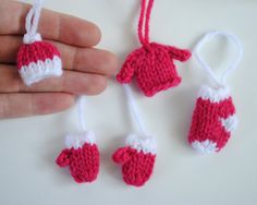 crocheted ornaments are being held in the palm of someone's hand