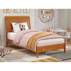 a child's bedroom with a bed, dresser and toy animal on the floor