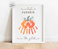 a white frame with an orange pumpkin on it and the words, eat pumpkin on the inside