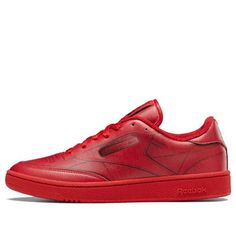 Step into luxury with the Maison Margiela x Reebok Club C ‘Vector Red’. This show-stopping trainer is crafted from a single piece of flat leather, printed with a scanned image of a Reebok Club C for a trompe-l’oeil effect that will have heads turning. The seamless build is accented with a matching red toe bumper and heel tab, the latter marked with Margiela’s signature embroidered detailing. The label’s numerical logo adorns the woven tongue tag. Whether you’re hitting the gym or the streets, th Club C Reebok, Reebok Club C, Club C, S Signature, Single Piece, The Streets, The Label, Turning, Gym