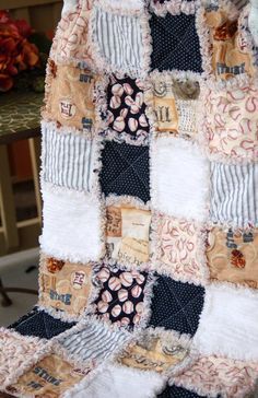 a patchwork quilt is sitting on a chair