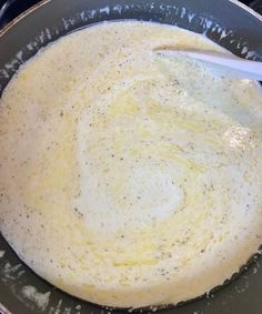 an omelet is being prepared in a skillet