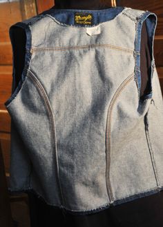 "This is a 1960s Blue Jean Wrangler Denim Vest. It is 100% Cotton made in the USA It has a classic Vintage design with 2 patch pockets and the Wrangler Rope Logo on the label. It is in Excellent Vintage Condition. The vest has metal signed buttons It is marked medium I think this means a 60's Medium which would be a bit tight now. So I'm calling it a Man's S and a Woman's Medium Please check measurements. Across shoulders at back - 12\" Across the chest at bottom of armpit holes - 18\" (X2) Coll Cotton Denim Jacket With Pockets For Rodeo, Vintage Cotton Denim Jacket For Rodeo, Mechanic Coveralls, Western Suits, Reversible Vest, Memphis Tn, Old Clothes, Wool Vest, Have Metal