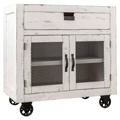 an old white cabinet with two doors on wheels