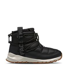 Brave those wet and snowy days with your feet snugly wrapped in these women's The North Face Thermoball TNF Black/Gardenia white winter boots. Made of water-repellent, recycled P. E. T. ripstop upper with a waterproof DryVent bootie construction, these cold weather booties have a round toe front and pull-on design with lace-up front panel for a snug fit and bungee collar with toggle to keep snow away. Features include non-PFC durable water-repellent finish to help keep feet dry, dual webbing pul White Winter Boots, Super Puff, The North Face Shoes, North Face Shoes, Womens Rain Boots, Winter Boots Women, North Face Women, Dream Shoes, Waterproof Boots