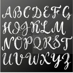 handwritten english alphabet on blackboard with white chalk writing and capital letters in the upper corner