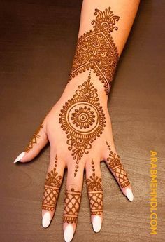 henna tattoo on the palm of a woman's hand