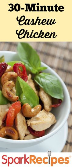 a white bowl filled with chicken and vegetables