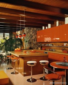 a kitchen with orange cabinets and stools