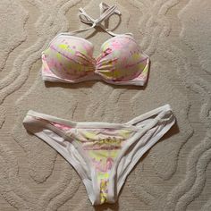 This Bikini Has Never Been Worn. It Has A Halter Top And Adjustable Back. The Bottoms Are Medium Coverage With A Cutout Detail On The Side. White Victoria's Secret Swimwear For Summer, Victoria's Secret Fitted Swimwear For Spring, Fitted Victoria's Secret Swimwear For Spring, White Fitted Victoria's Secret Swimwear, White Victoria's Secret Swimwear For Poolside, Victoria's Secret White Swimwear For Pool, Victoria's Secret White Swimwear, Aesthetic Swimsuit, Victoria Secret Swim