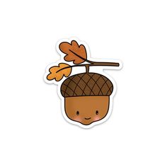 a sticker with an acorn on it's head and leaves hanging from the top