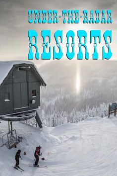 people are skiing in the snow next to a small cabin on top of a mountain