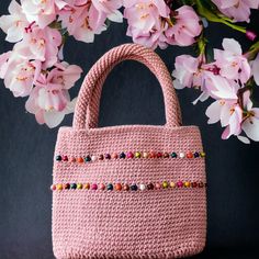 Looking for a stylish and unique accessory to add to your wardrobe? Look no further than my beaded crochet bags with shoulder straps! These bags are the perfect blend of functionality and fashion, with a versatile design that can be dressed up or down to suit any occasion. My beaded crochet bags are handcrafted using high-quality materials, each bag is one-of-a-kind and built to last. The intricate beading adds a touch of glamour to the classic crochet design, making these bags a statement piece Rectangular Beaded Crochet Bag For Daily Use, Everyday Beaded Crochet Tote Bag, Pink Hand-knitted Crochet Bag For Daily Use, Daily Use Pink Handmade Crochet Bag, Everyday Bohemian Pink Crochet Bag, Everyday Pink Bohemian Crochet Bag, Knit Bag, Evening Accessories, Intricate Beading