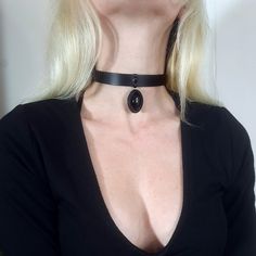 "Large leather choker necklace for men and women made of upcycled leather, shaped by hand onto an onyx cabochon stone. Adjustable at the back with a belt This  leather jewelry is ideal for gothic victorian girls, fine stones lovers and will make a cool present for \"all black everything\" enthusiastics ! 🎨 Color: Black 📏 Size guide: adjustable, it is perfect for a gift (you can add your neck tour in the comment while ordering)  You would prefer the long pendant necklace ?https://www.etsy.com/f Mystical Choker Jewelry For Gifts, Handmade Gothic Choker Jewelry, Mystical Choker Jewelry For Festivals, Mystical Choker Jewelry Gift, Black Onyx Choker Jewelry, Adjustable Black Gothic Jewelry, Minimalist Black Leather Necklace, Adjustable Gothic Choker Jewelry, Mystical Style Black Choker Jewelry