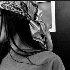 black and white photograph of woman with bandana on her head