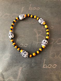 This is a Halloween Skull Bracelet. It would make a spooky addition to a teen's Halloween costume. It would make a great gift for a teen or woman for Halloween. It has orange and black seed beads. It has five skull beads. It was made with .8mm sturdy stretch string. I tie it several times to prevent breakage. It fits most teens and women. It stretches to fit on the wrist. All items are ready to be shipped I do combined shipping. Items ship in 2-5 business days. Check out more items at: http://www.etsy.com/shop/MesheleCrafts https://www.facebook.com/MesheleCrafts Cheap Orange Halloween Bracelets, Handmade Halloween Festival Bracelets, Handmade Halloween Festival Bracelet, Halloween Novelty Beaded Bracelets With Round Beads, Handmade Beaded Bracelets For Halloween, Novelty Beaded Bracelets For Halloween, Halloween Novelty Bracelet With Round Beads, Handmade Adjustable Bracelets For Halloween, Spooky Adjustable Bracelets For Halloween